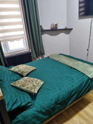 Ένα ή περισσότερα κρεβάτια σε δωμάτιο στο Guesthouse Djulia