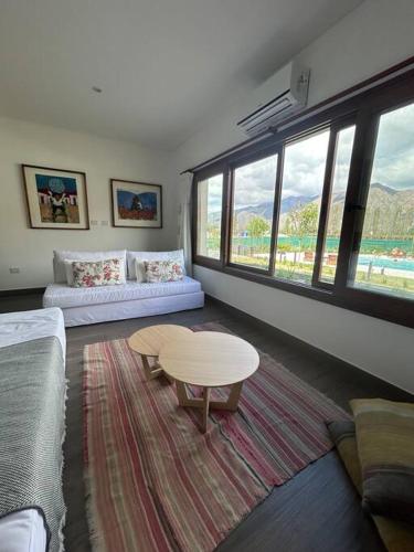 a living room with a couch and a table at El loft mas lindo de Cafayate! in Cafayate
