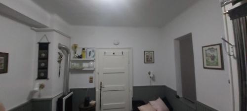 a hallway with a white door in a room at MIDI ROOM terrace wifi carparking in Siófok