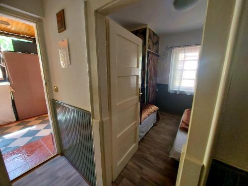 a hallway with a door leading to a living room at MIDI ROOM terrace wifi carparking in Siófok