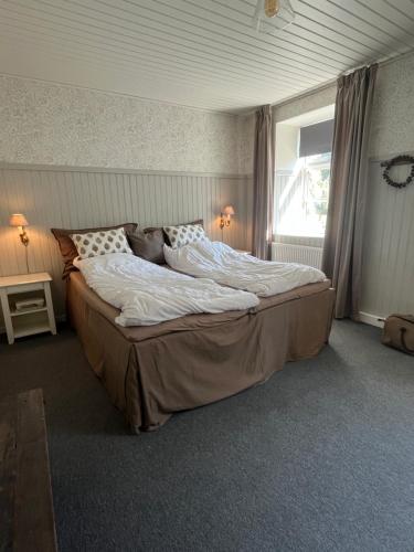 Postel nebo postele na pokoji v ubytování Stenhuset - Country House