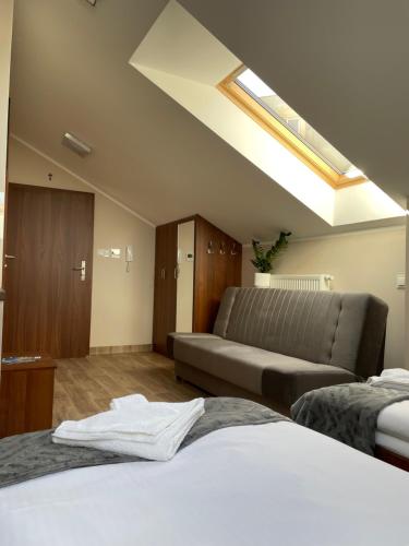 Postel nebo postele na pokoji v ubytování Apartamenty Akant