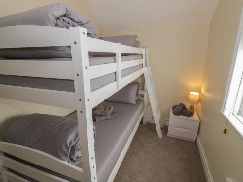 a bedroom with two bunk beds in a room at Above The Pub in Birmingham