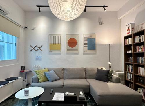 a living room with a couch and a table at 衛民家 wei min home in Tainan