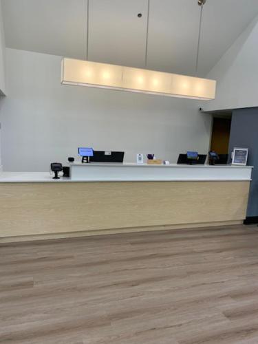 an empty office with a reception desk in a room at Sleep Inn Staunton in Staunton
