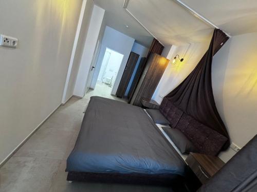 a bedroom with a large bed in a room at Hotel Linzer City in Linz