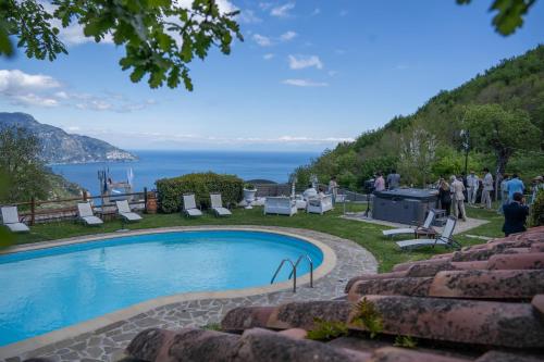 a swimming pool with a view of the ocean at Villa La Ventana in Sant'Agnello