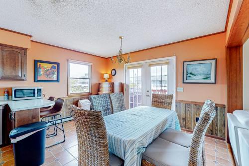 a kitchen and dining room with a table and chairs at Fenwick Island --- 20 W Maryland Avenue in Fenwick Island