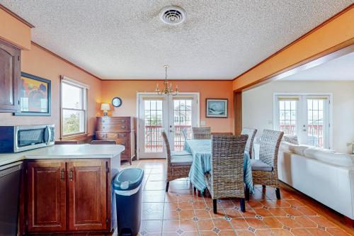 a kitchen and dining room with a table and chairs at Fenwick Island --- 20 W Maryland Avenue in Fenwick Island