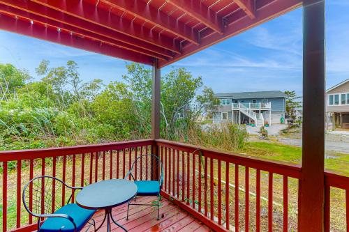 a patio with a table and chairs on a deck at Fenwick Island --- 20 W Maryland Avenue in Fenwick Island