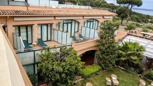 an aerial view of a house with a balcony at Hotel Sa Punta - Adults Only fr13 in Begur