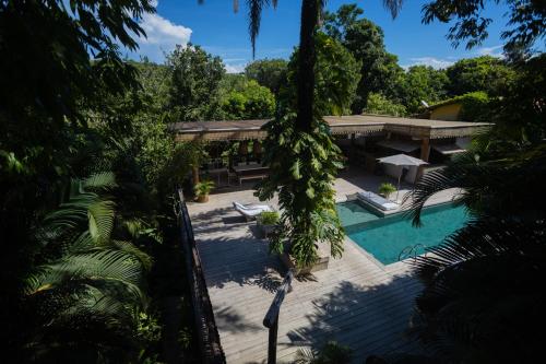 an aerial view of a resort with a swimming pool at Santa Fe Casas Hotel Trancoso in Trancoso