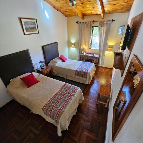 Una cama o camas en una habitación de Hotel Tafí