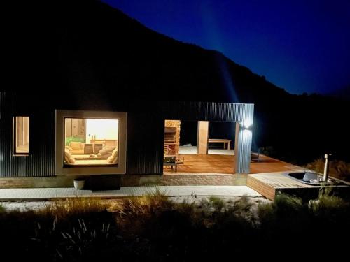 a house with a large window on the side of it at The Unbound - Escape the Ordinary in Romansrivier