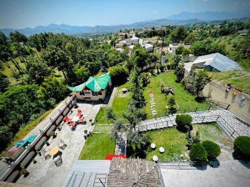 an aerial view of a park with tables and chairs at Summit Resorts (Republika Central) in Abbottabad