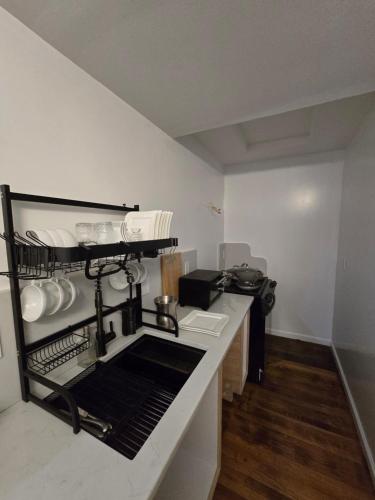 a kitchen with a drying rack on a counter at Beautiful Boston Bedroom - New Renovation in Boston