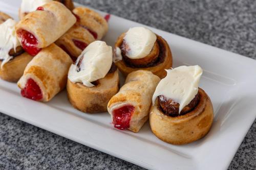 a plate of pastries with cream cheese and cherries at Harbor Town Inn, BW Signature Collection in Manitowoc