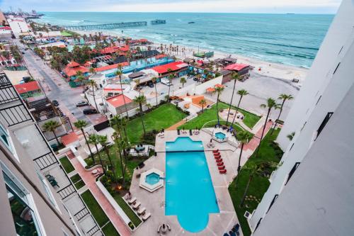 an aerial view of a resort with a swimming pool and the ocean at Beach Paradise Luxury Views Here in Rosarito