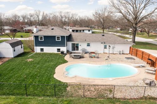 an overhead view of a backyard with a pool and a house at Hometown Hideaway - 4br25ba, Pool, Game Room in Greenwood