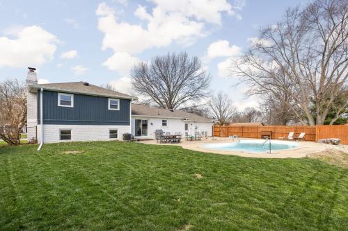 a backyard with a pool and a house at Hometown Hideaway - 4br25ba, Pool, Game Room in Greenwood