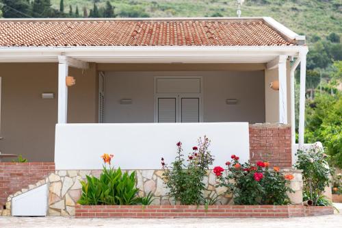 a white fence in front of a house at Villa Mare E Monti in Castellammare del Golfo