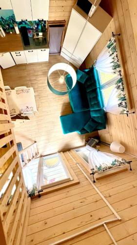 an overhead view of a tiny house with blue furniture at Skrawek Nieba Borsk in Borsk