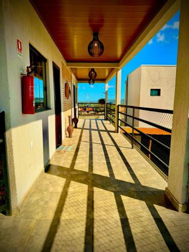 a balcony of a building with a view of the ocean at Mangabeiras - Casa de Hóspedes in Alto Paraíso de Goiás