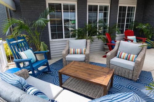 a group of chairs and a table on a patio at Harbor Town Inn, BW Signature Collection in Manitowoc