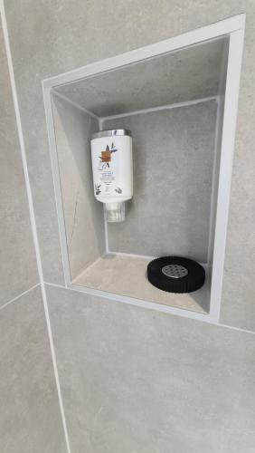 a urinal in a bathroom with a drain at Le Loft de Village-Neuf - Résidence 4 étoiles in Village-Neuf