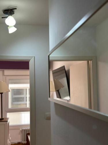 a mirror on a wall in a room at Piso da Ulla in A Estrada
