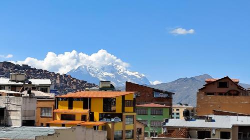 a group of buildings with a mountain in the background at Departamento céntrico y amoblado La Paz in La Paz