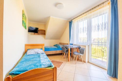 Ένα ή περισσότερα κρεβάτια σε δωμάτιο στο Majka