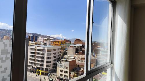 a view of a city from a window at Departamento céntrico y amoblado La Paz in La Paz