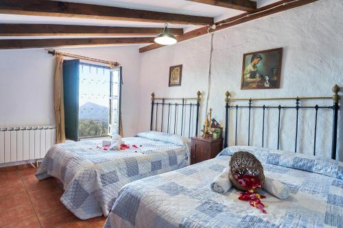 Un pat sau paturi într-o cameră la La Sierrezuela