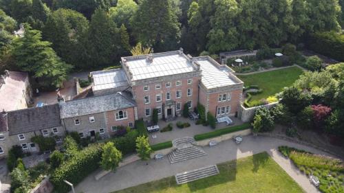 an aerial view of a large brick house with a yard at Easby Hall in Richmond