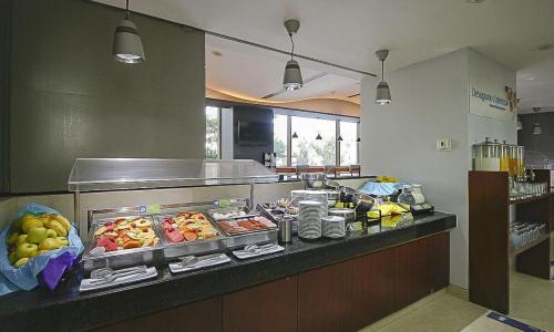 a buffet line in a restaurant with food at Holiday Inn Express Mexico Reforma by IHG in Mexico City