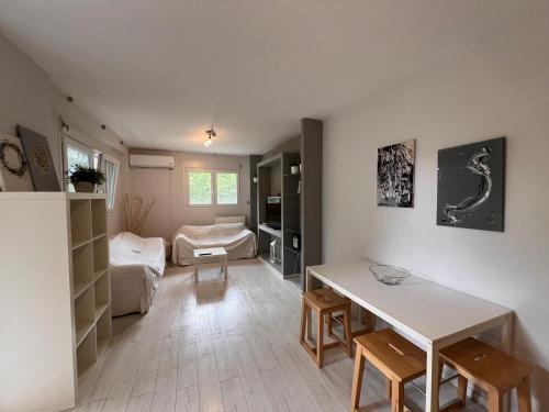 a living room with a table and a couch at Maria’s apartments in Sparti