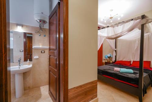 a bedroom with a bed and a sink in a room at El Gouna 2 bedrooms apartment South Marina Ground Floor in Hurghada