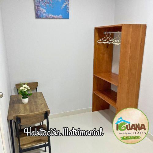 a room with a table and a basketball hoop at IGUANA HAUS IQUITOS in Iquitos