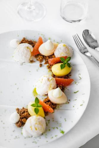 a plate of food with vegetables and ice cream at Bdesign & Spa in Paradou