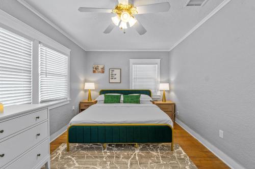 a bedroom with a bed and a ceiling fan at Bankers Hill Hideaway with AC Views and Parking in San Diego