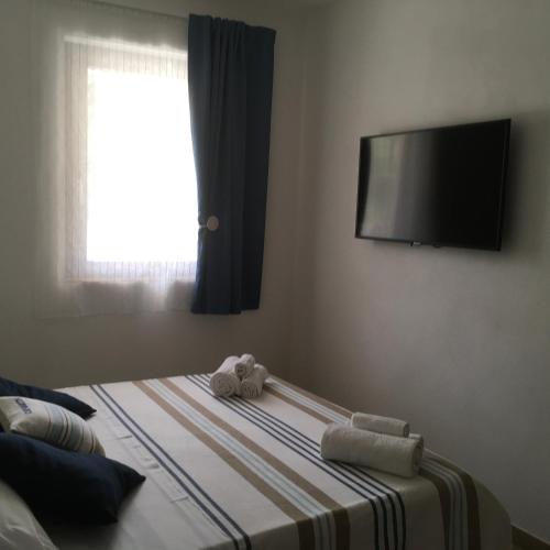 Ένα ή περισσότερα κρεβάτια σε δωμάτιο στο Agriturismo Adenzia