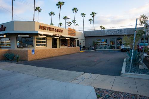 an empty parking lot in front of a store at 1 Block from Beach - Steps from Restaurants & Shops in Oceanside