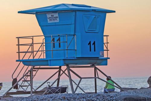 a life guard tower on the beach at 1 Block from Beach - Steps from Restaurants & Shops in Oceanside