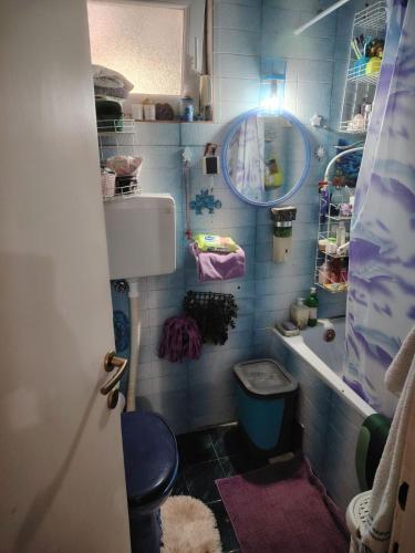 a small bathroom with a toilet and a sink at Alex in Kijevo