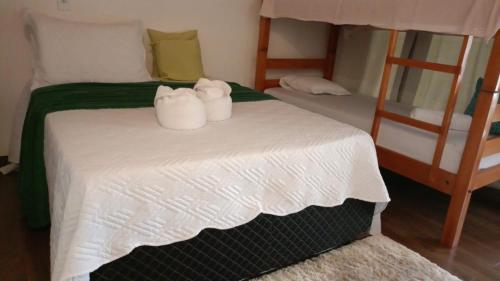 Una cama o camas en una habitación de Pousada e Restaurante Sumaúma