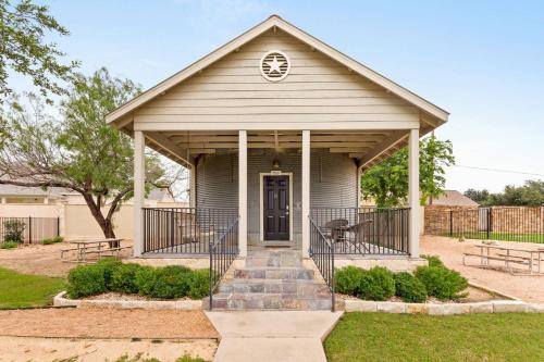 a small house with a porch with a door at #21 The Silo in Gruene in New Braunfels