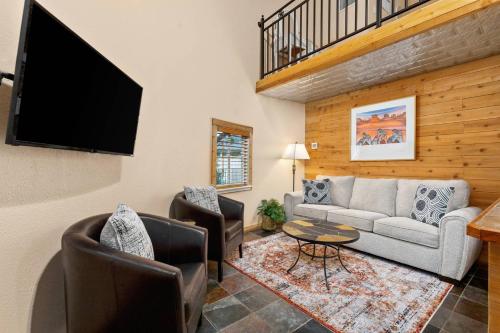 a living room with a couch and a flat screen tv at #21 The Silo in Gruene in New Braunfels