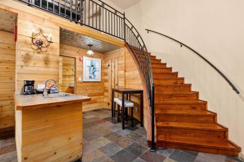 a staircase in a cabin with a sink and a table at #21 The Silo in Gruene in New Braunfels