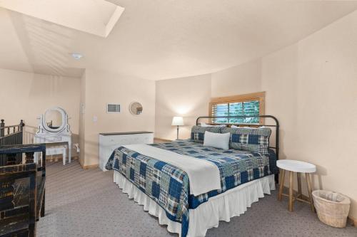 a bedroom with a bed and a table and a mirror at #21 The Silo in Gruene in New Braunfels